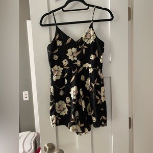 Black floral romper. Never worn